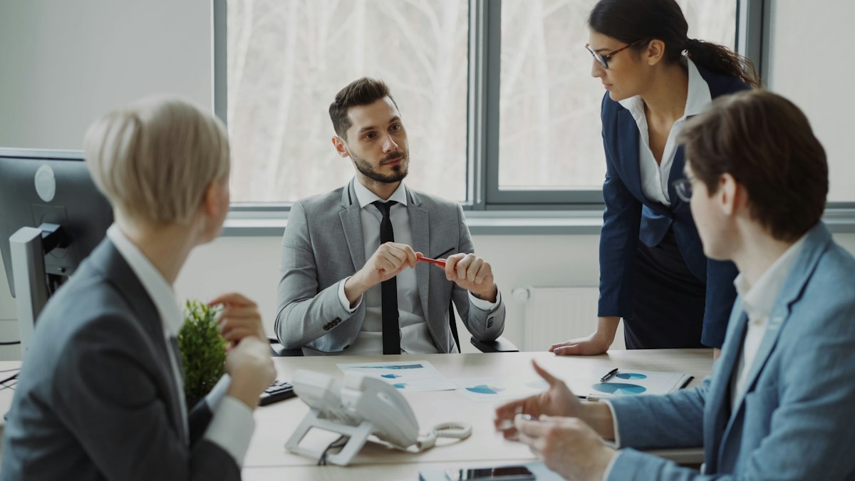 HCN Global consulting team discussing strategy with a client around a conference table