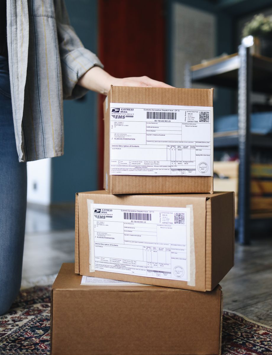 Stacked parcels with shipping labels ready for delivery